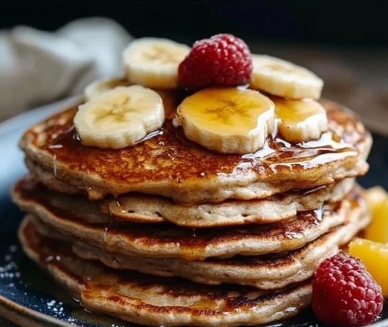 Delicious 3 ingredient banana oatmeal pancakes stacked on a plate