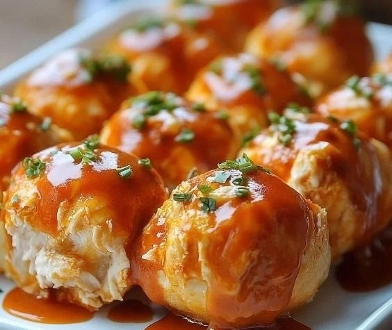 Delicious Buffalo Chicken Bombs filled with cheesy chicken and spicy sauce