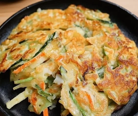 Delicious crispy Korean vegetable pancakes served with dipping sauce