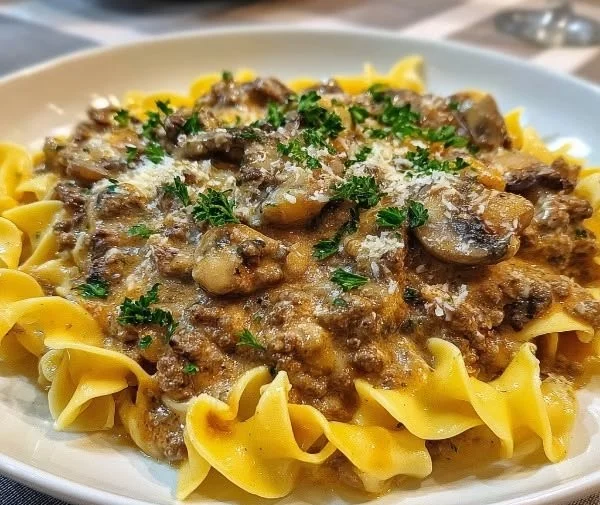 Delicious ground beef stroganoff served over noodles